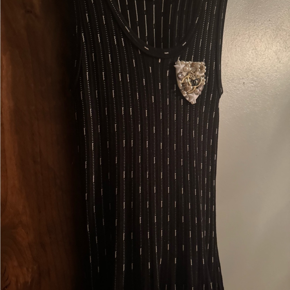 Sleeveless Black Mini Dress with Metallic Pin Accent